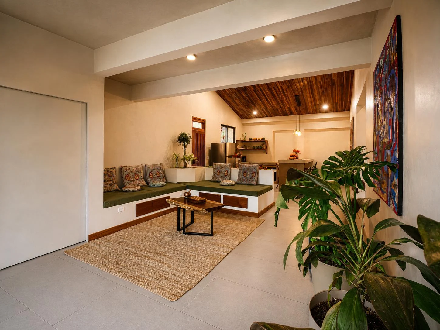 Open living area with warm timber ceilings, plants, and views into the garden