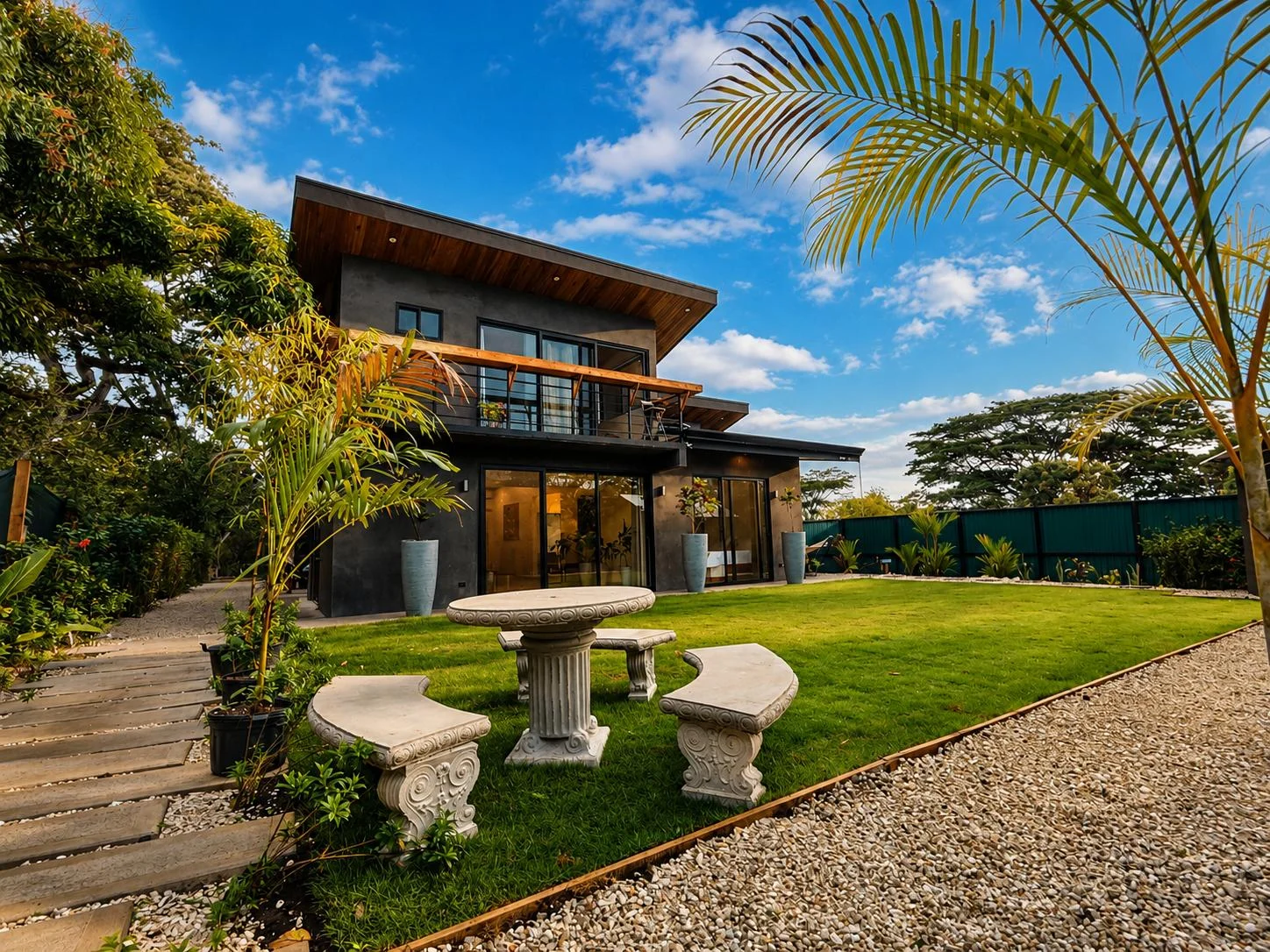 Villa Zelvara framed by palms and gardens in Cabuya